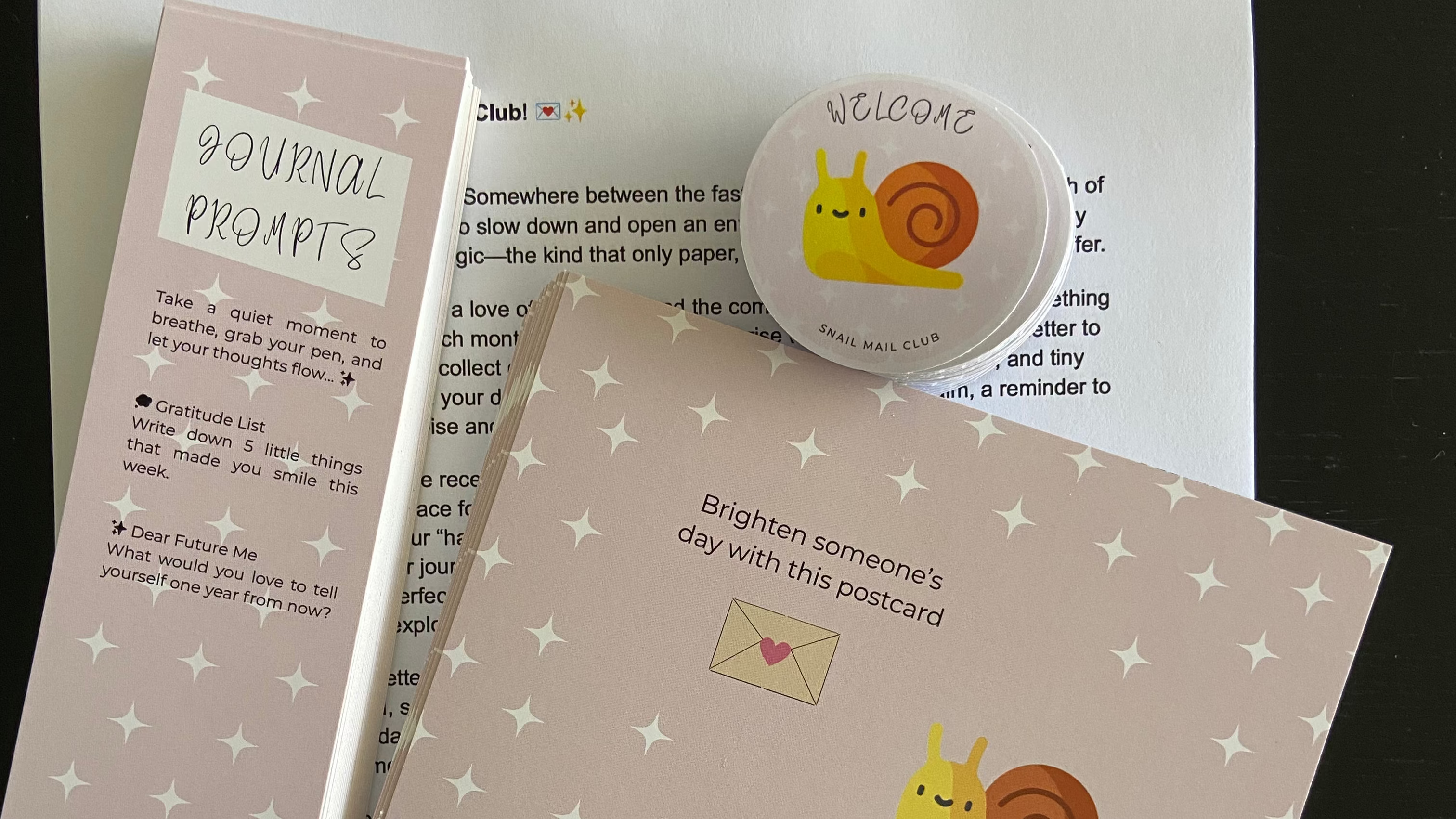 Set of postcards with snail design on a white surface